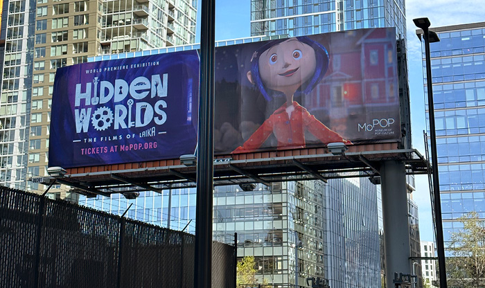 Billboard at Seattle Center promoting the Hidden Worlds exhibit
